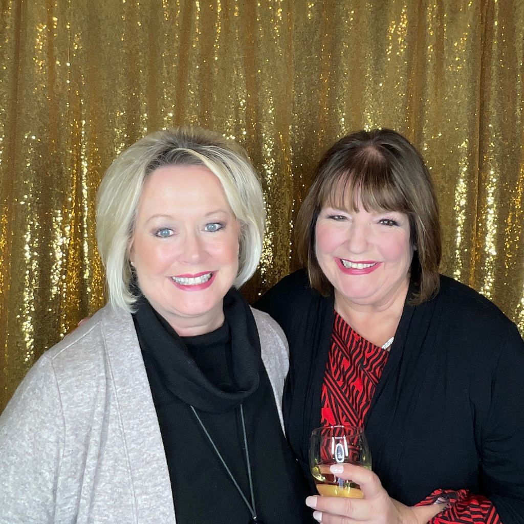 two women posing for a photo shoot at pohze photo booth in ottawa