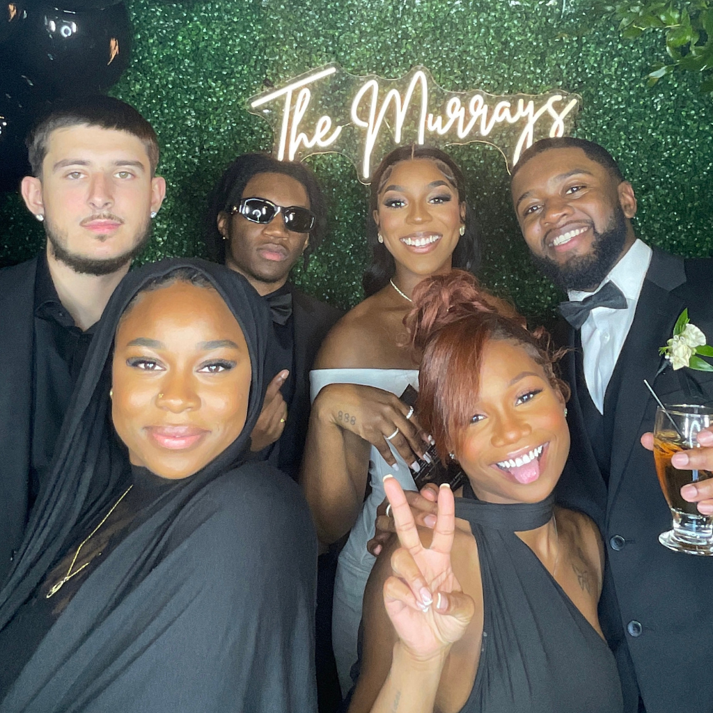 group of friends posing for a photo shoot at pohze photo booth in ottawa