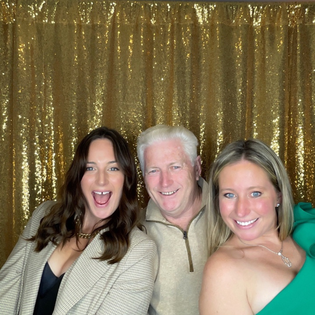 two women and a man posing for a photo shoot at pohze photo booth in ottawa